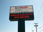 AccuHealth, pole sign with monochrome LED message center by Signs Manufacturing.