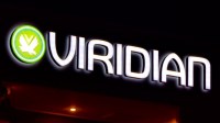 Veridian Wall Sign at Night