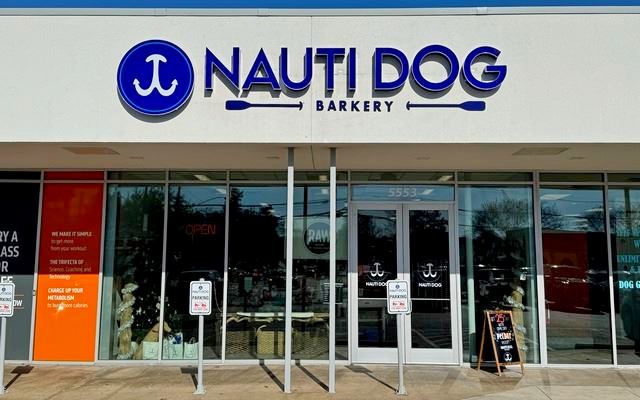 Illuminated building sign mounted on a Dallas commercial building