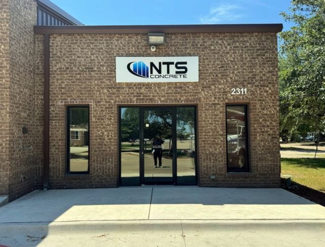 Building sign installation on a commercial building in Dallas TX